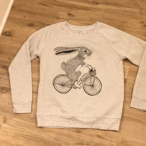 Soft grey sweatshirt with rabbit on a bike
